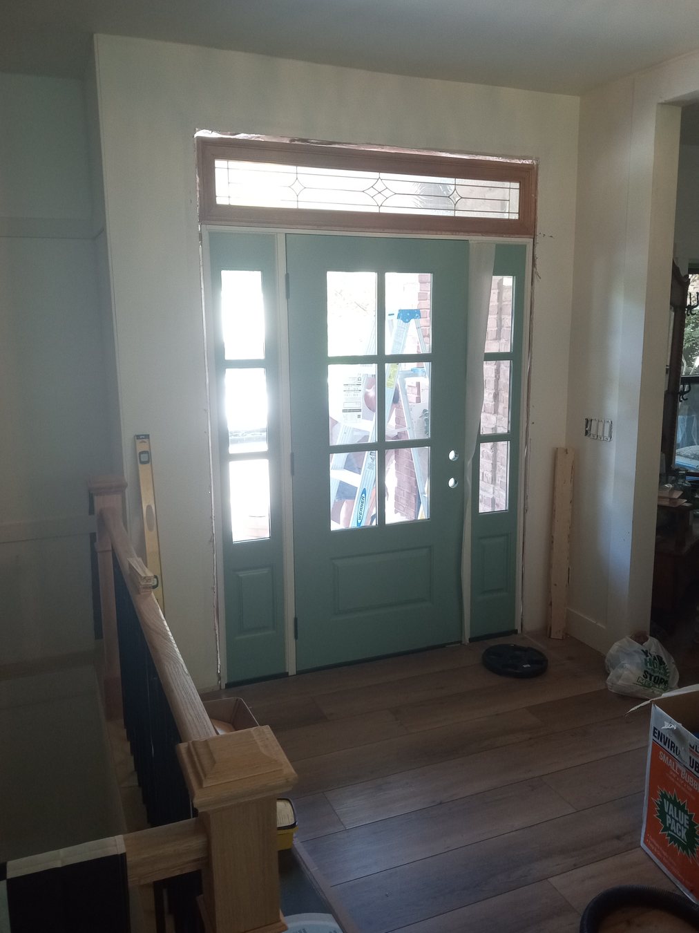 A front door and hardware detail ready for adjustment