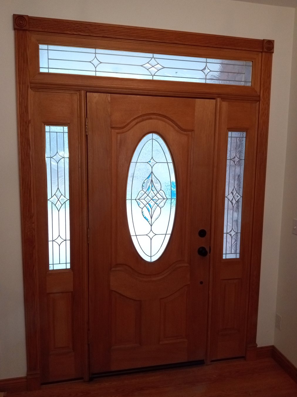 Finished wood entry door and hardware